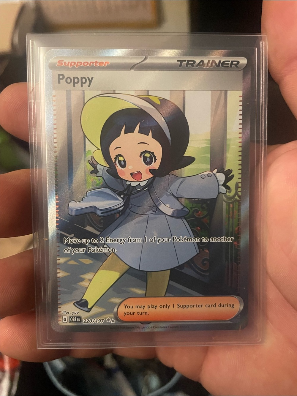 Poppy Trainer Pokémon Card -
